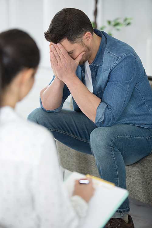 A man struggling with heroin addiction participates in a treatment program.