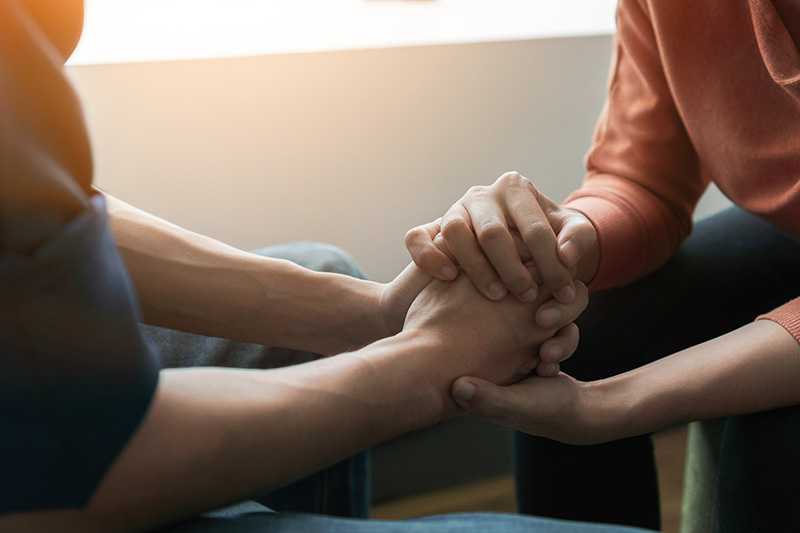 A person supports their loved one in addiction recovery.