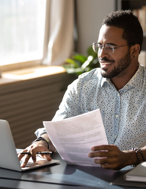 A man researches insurance coverage for alcohol rehab.