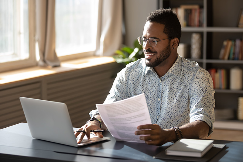 A man researches insurance coverage for alcohol rehab.