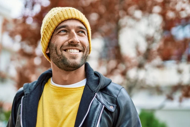 A man is happy in early sobriety.