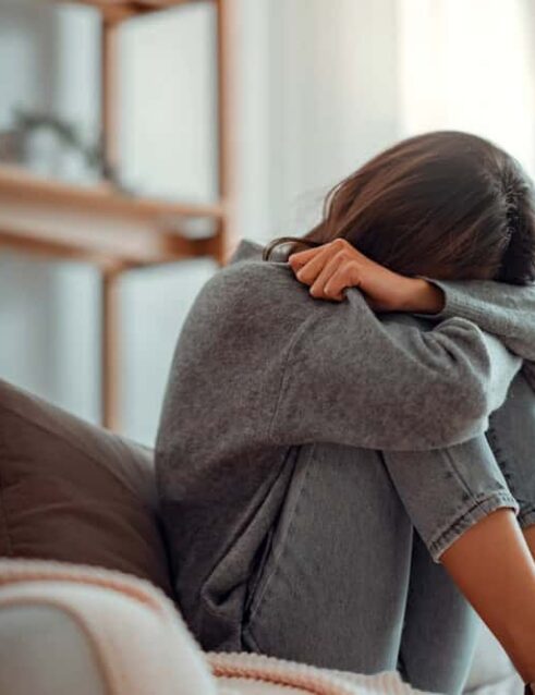 Upset young woman, wondering if severe depression a disability.