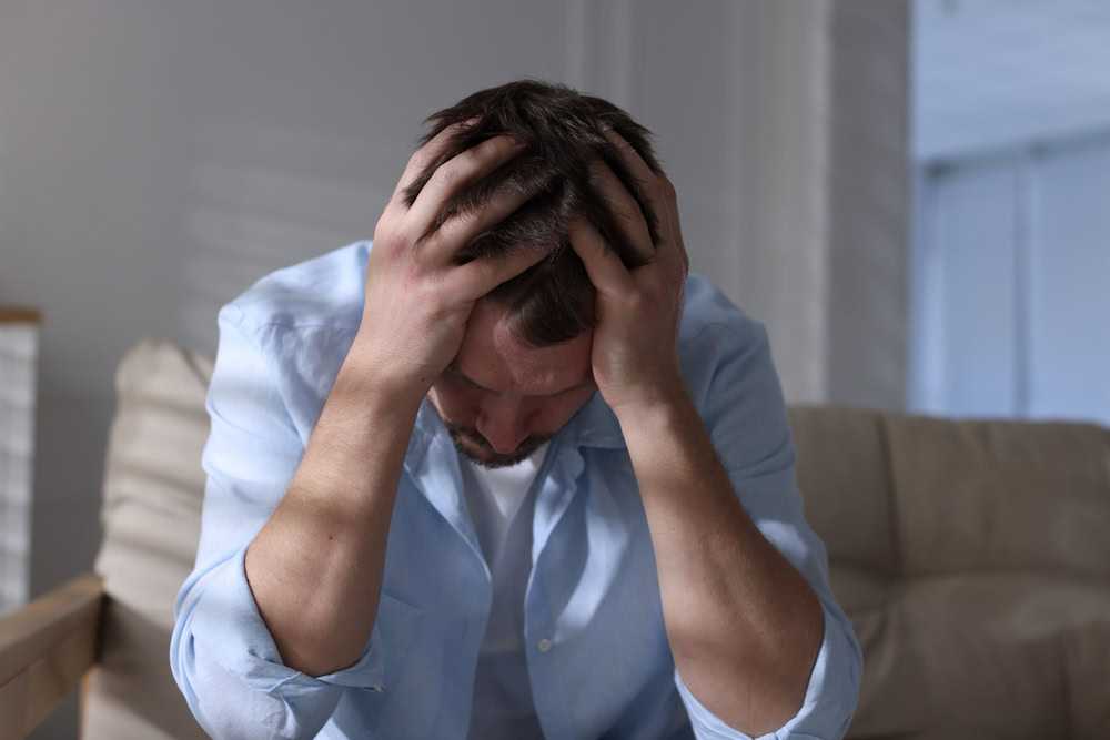 Man distressed about why does someone become addicted to drugs.